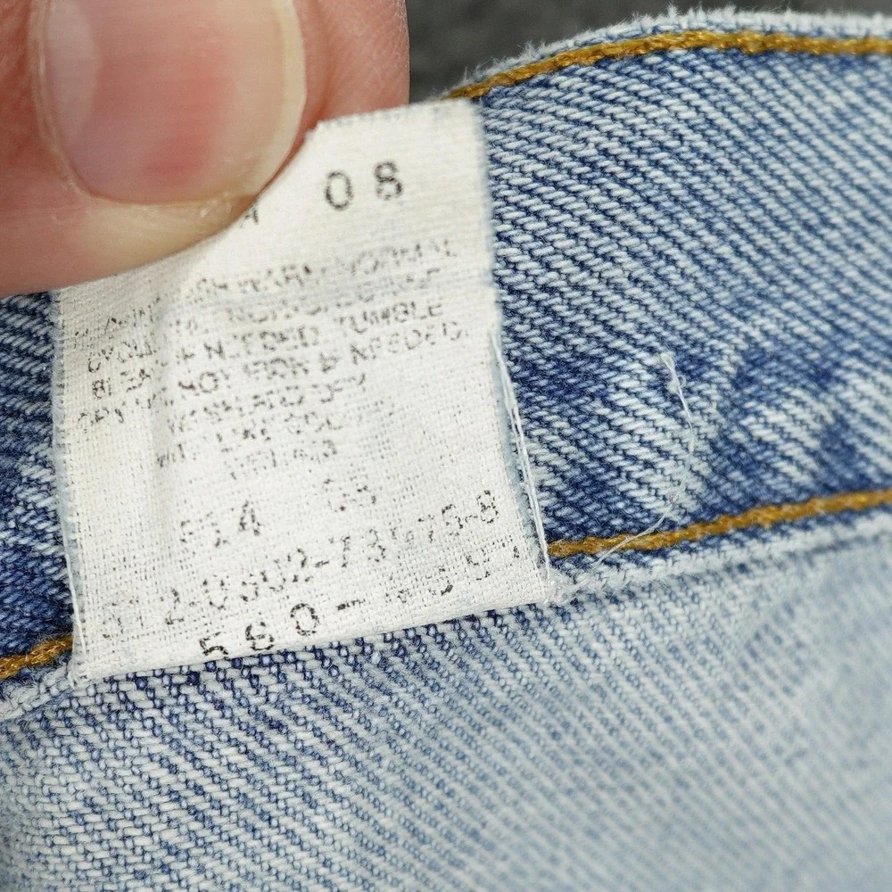 Vintage Levis 560 Jeans Mens 36x26 Light Wash Blue Relaxed Tapered Raw Hem